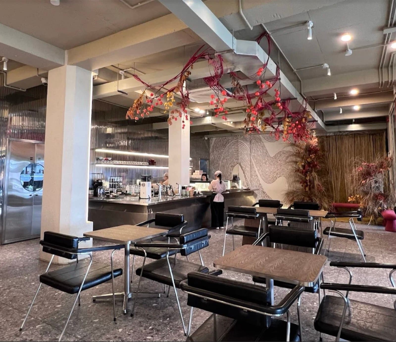 Bloom, the cafe floor with the wave wall and river light