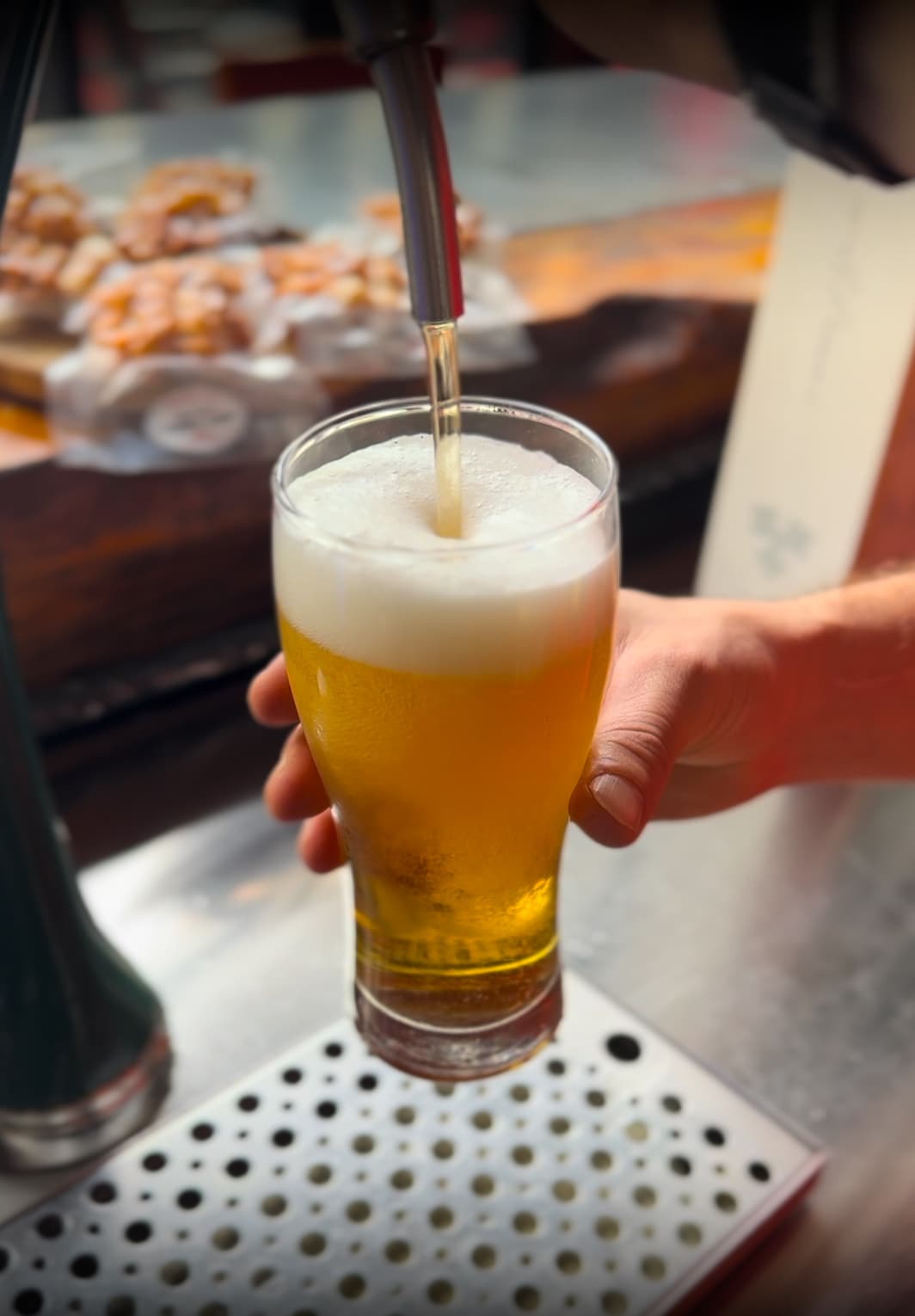 A cold beer being poured from the tap at Dirty Fingers in Da Nang
