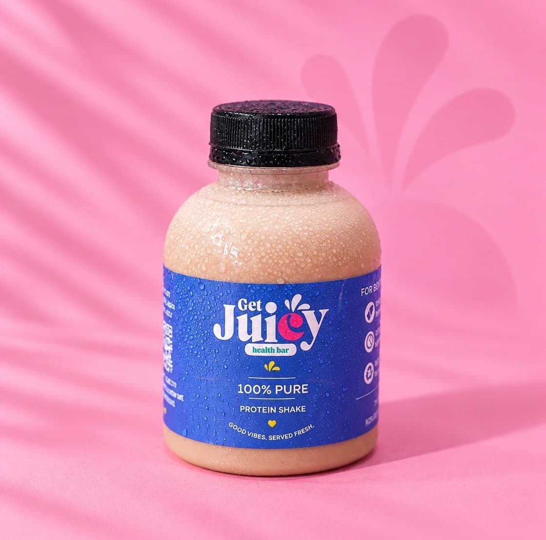 A GetJuicy Health Bar bottle labelled Protein Shake on a pink background