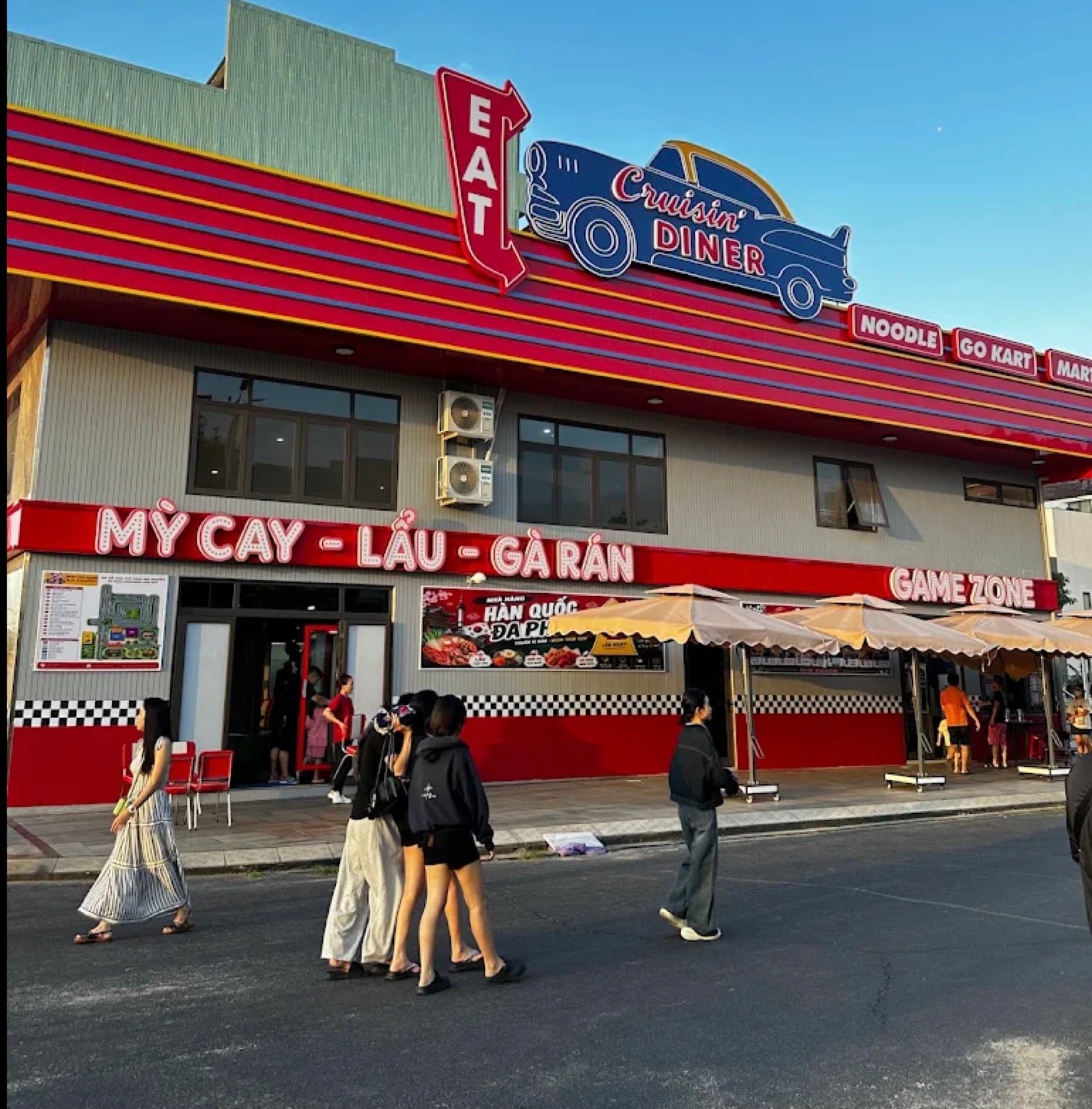 Go Kart Da Phuoc, the front of the building, with a signboard reading Eat, Noodle, Go Kart, Mart and Game Zone