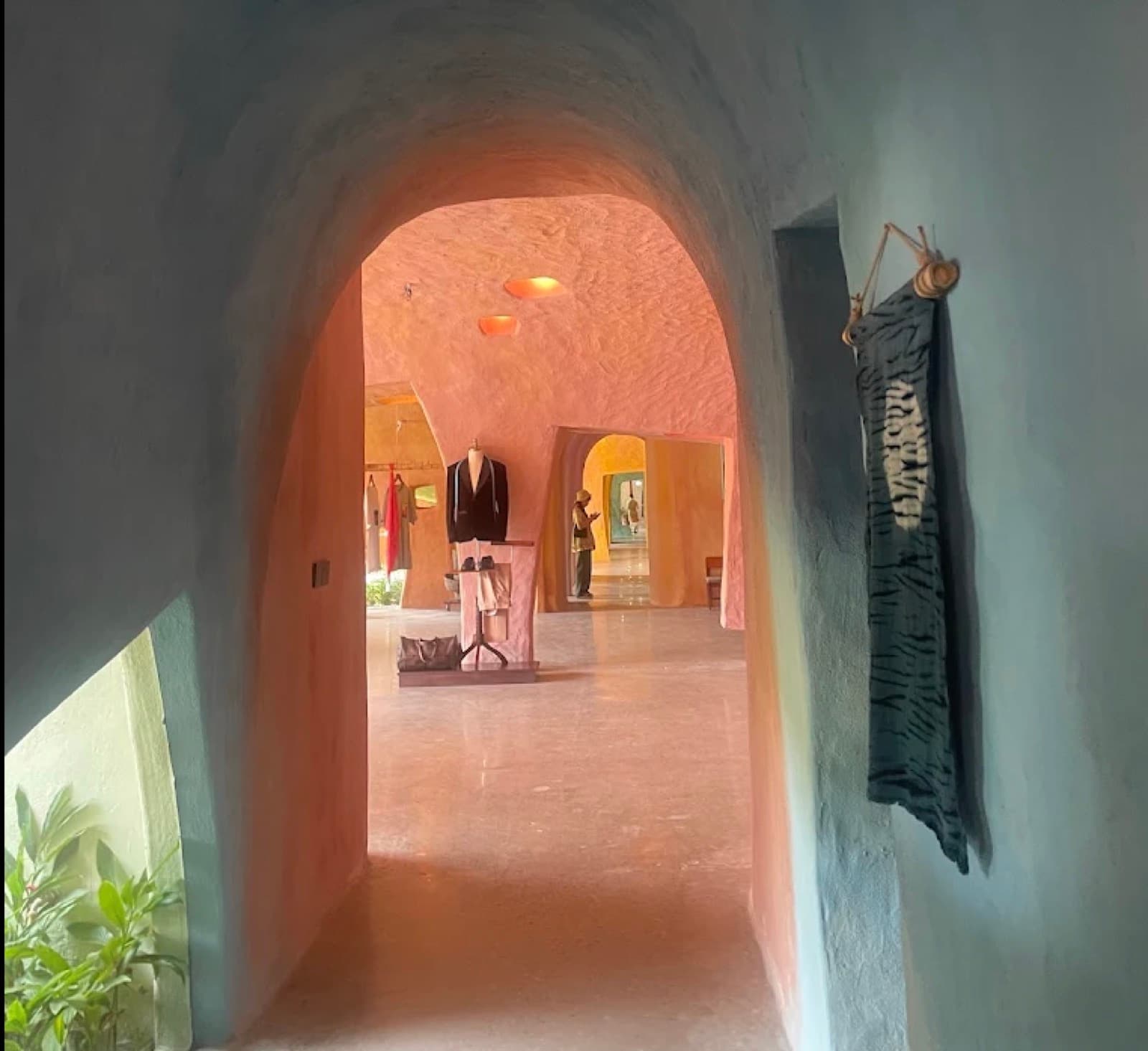 A hand rendered clay archway leading through the rooms at The Hangart